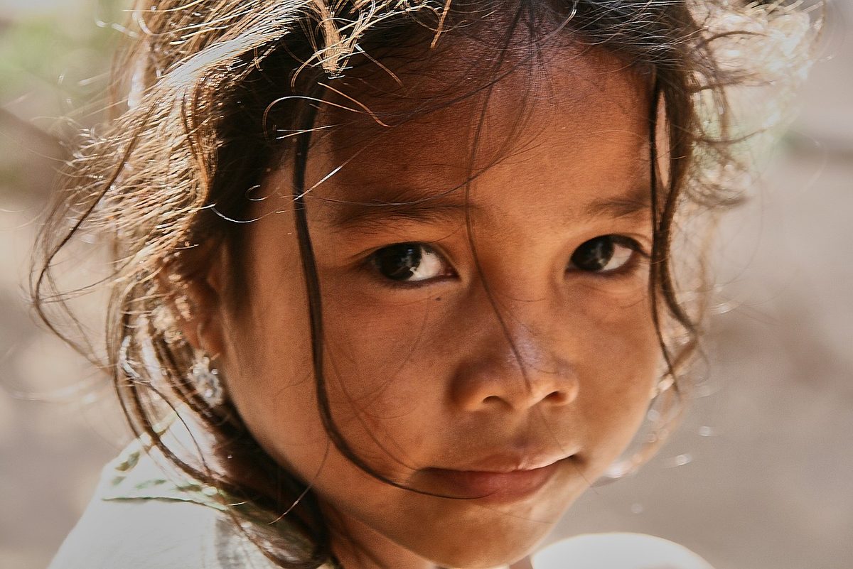 A young girl from the Tonle Sap community — one of the many lives IHM touches
