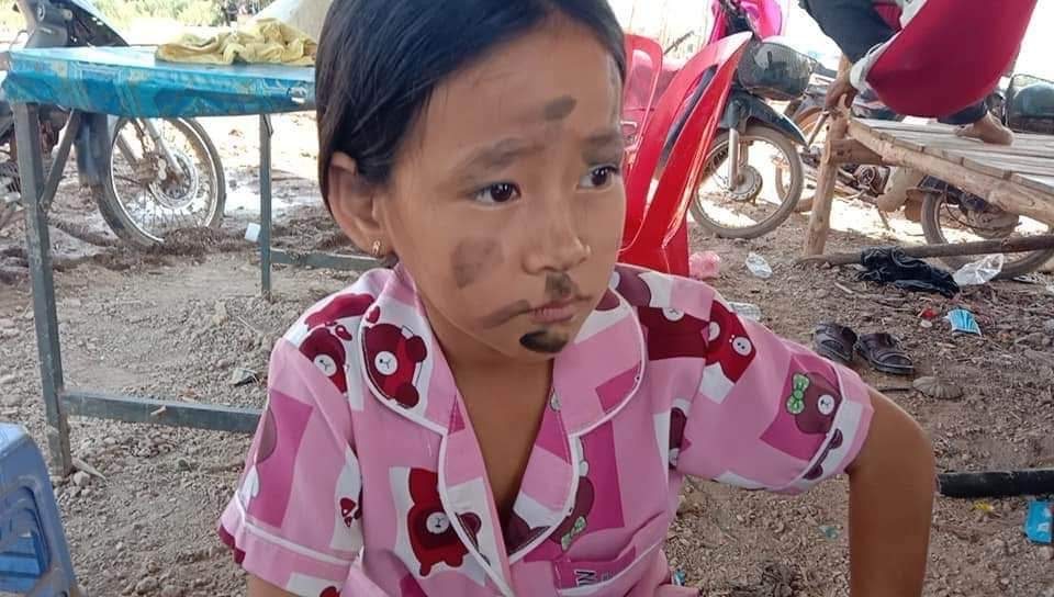 A child in the village after a day of work