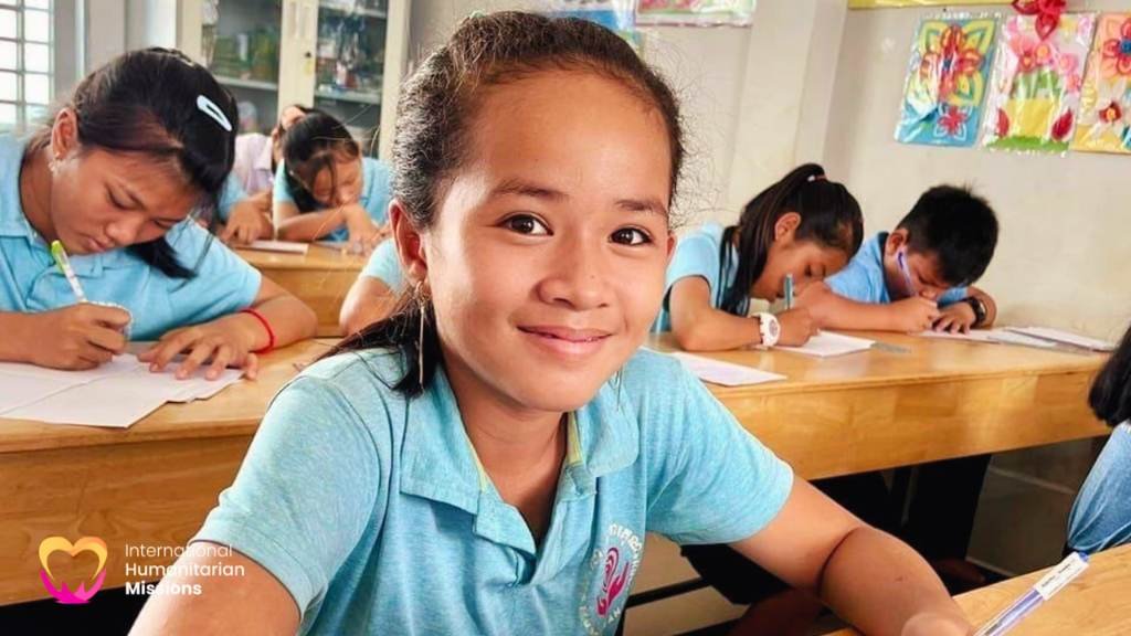 Tao smiling in her classroom at the IHM school